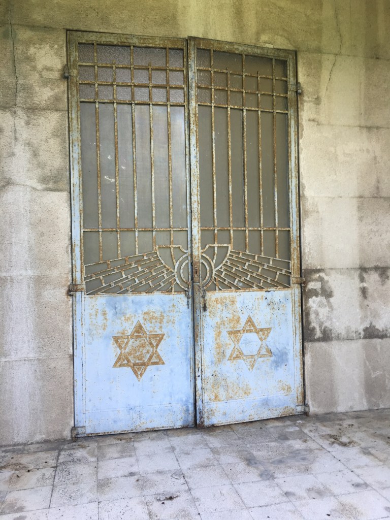 The imposing entrance to the Finzi Contini Tomb, Ferrara
