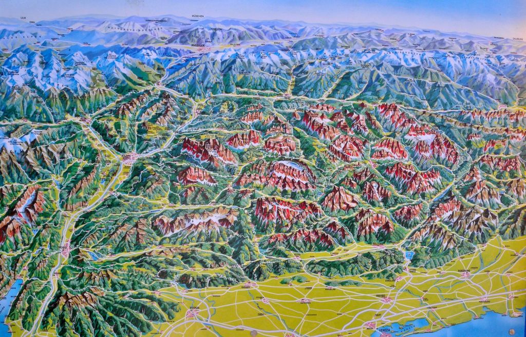 A relief map of The Dolomites - showing the Venetian plains in the foreground and the snow capped peaks of Switzerland and Austria to the top of the map.