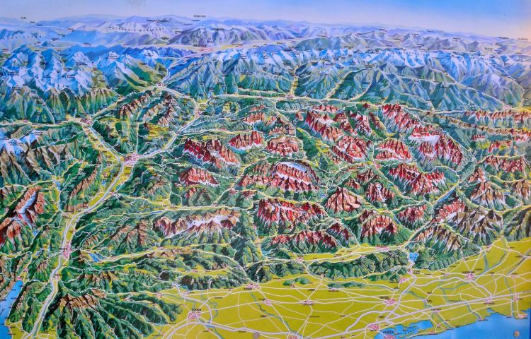 A relief map of The Dolomites - showing the Venetian plains in the foreground and the snow capped peaks of Switzerland and Austria to the top of the map.