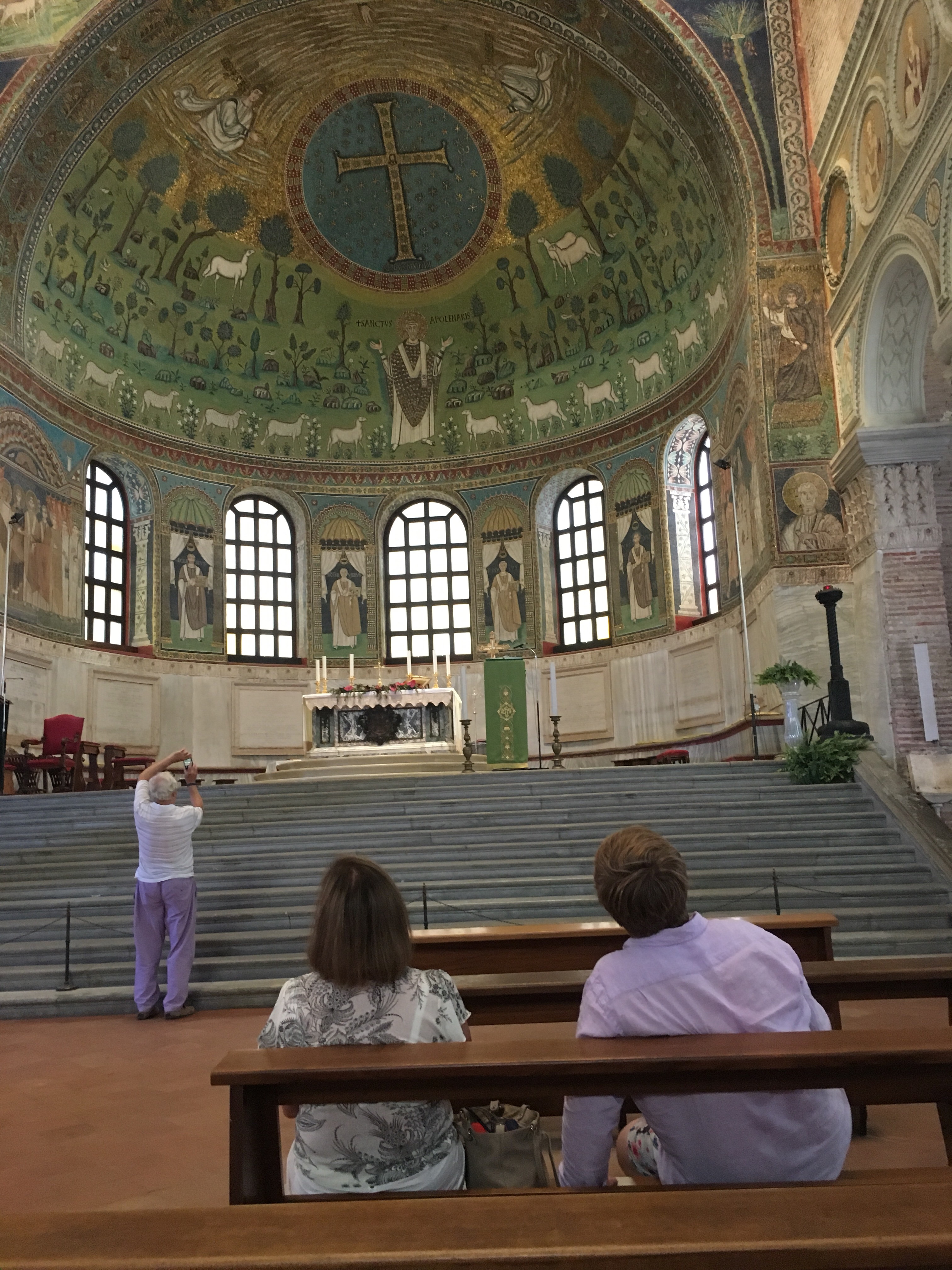 Visitors gaze in awe at the mosaics that decorate the apse, Sant' Apollinare in Classe