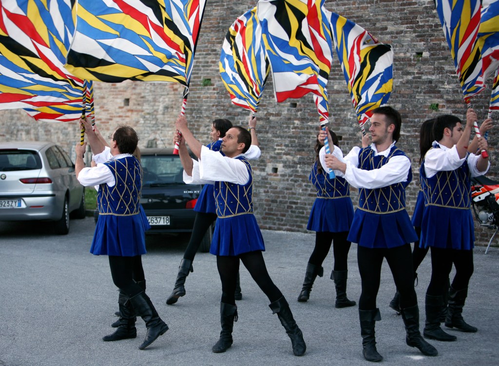 Corinaldo - getting into the groove - flags herald the medieval pagentry for which the town is famous.