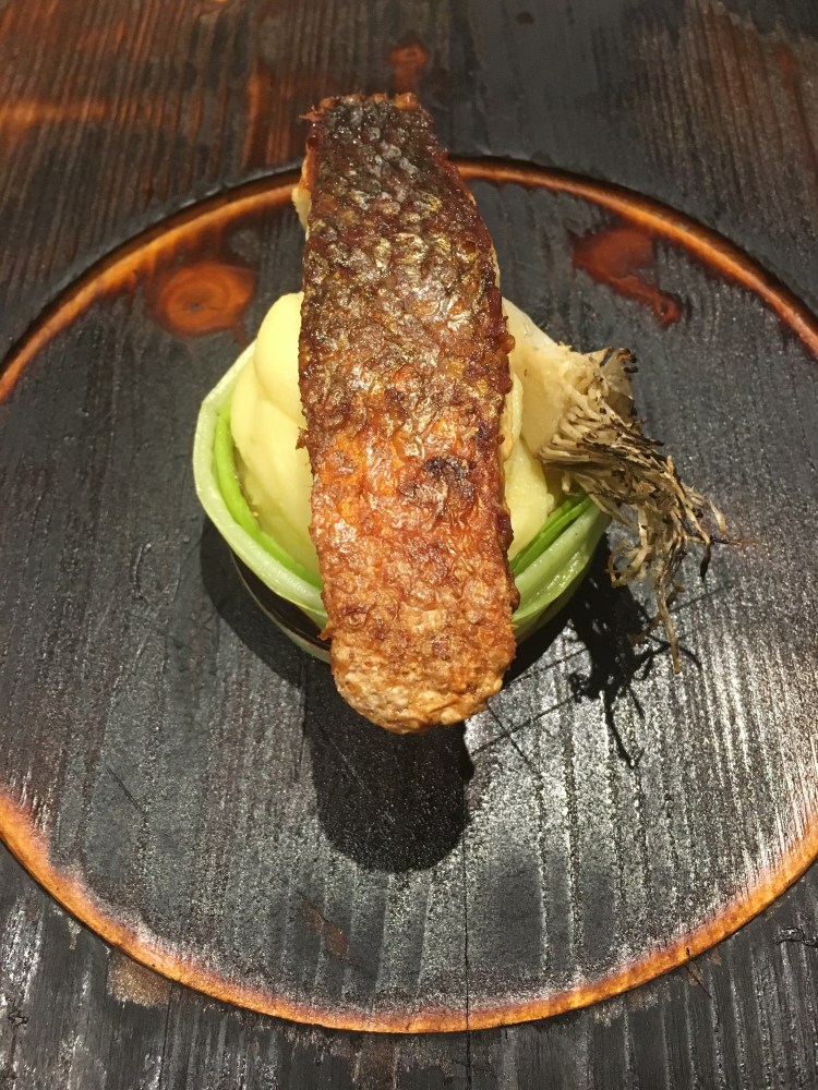 Bella Italia - Pesce, smoked branzino on a bed of creamed potatoes and leek