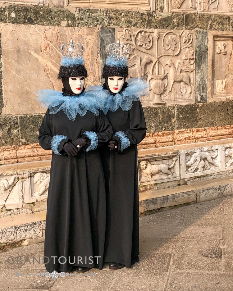 Venice - Carnevale - Grand Tourist - The twins pose and reveal the extraordinary detail of carving on the facade of St Mark's.