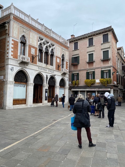 A typical day in Venice - queuing to get into the supermarket. Social distancing being observed.