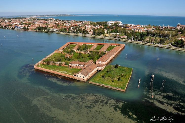 Venice - Quarantine Island of Lazzaretto Vecchio with Lido di Venezia in background. Beyond that is the Adriatic Sea