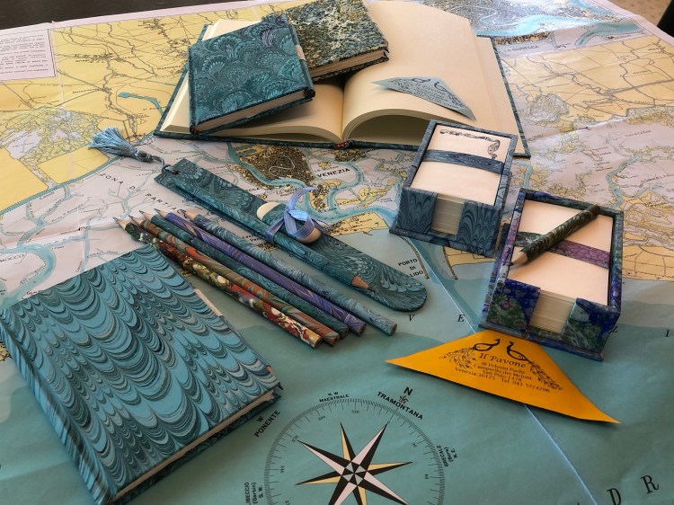 Il Pavone - Venezia sells a superb range of handmade note books, hand coloured papers, pencils and wonderful waste-paper baskets for the office.