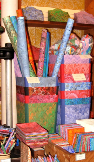 Il Pavone - Venezia sells a superb range of handmade note books, hand coloured papers, pencils and wonderful waste-paper baskets for the office.