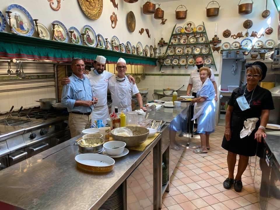 Here's Linda in the kitchen, second from right. The kitchen is just like home. Signora Linda steers the ship