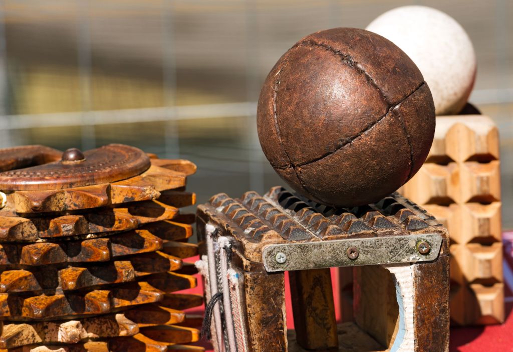 Leather ball and carved wooden arm protector - used in pallone col bracciale